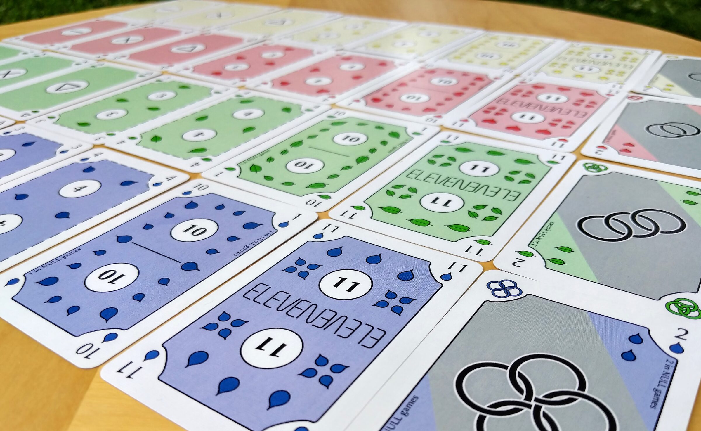 The Blue Rings deck of cards fanned out on a table