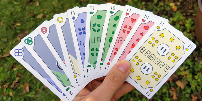 A full hand of Blue Rings cards fanned out, showing all four suits and the Ring cards